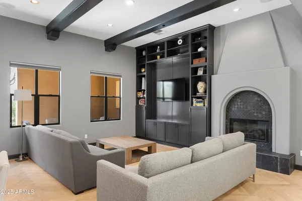 a living room with furniture and a fireplace