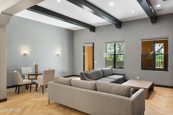 a living room with furniture and a window