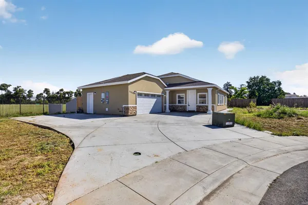 a front view of a house with garage
