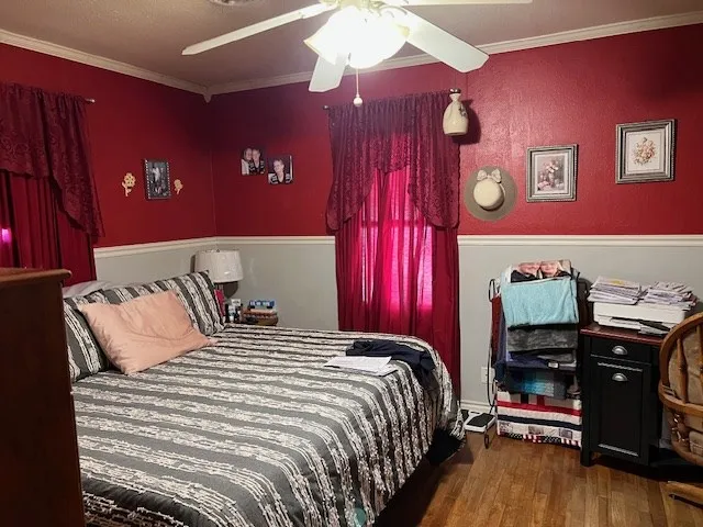 a room with a bed and a chandelier