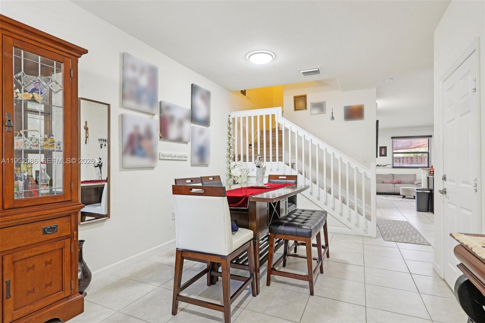11746 Southwest 151 Avenue Miami, FL 33196 - Photo 11 of 37 a view of a livingroom with furniture and staircase