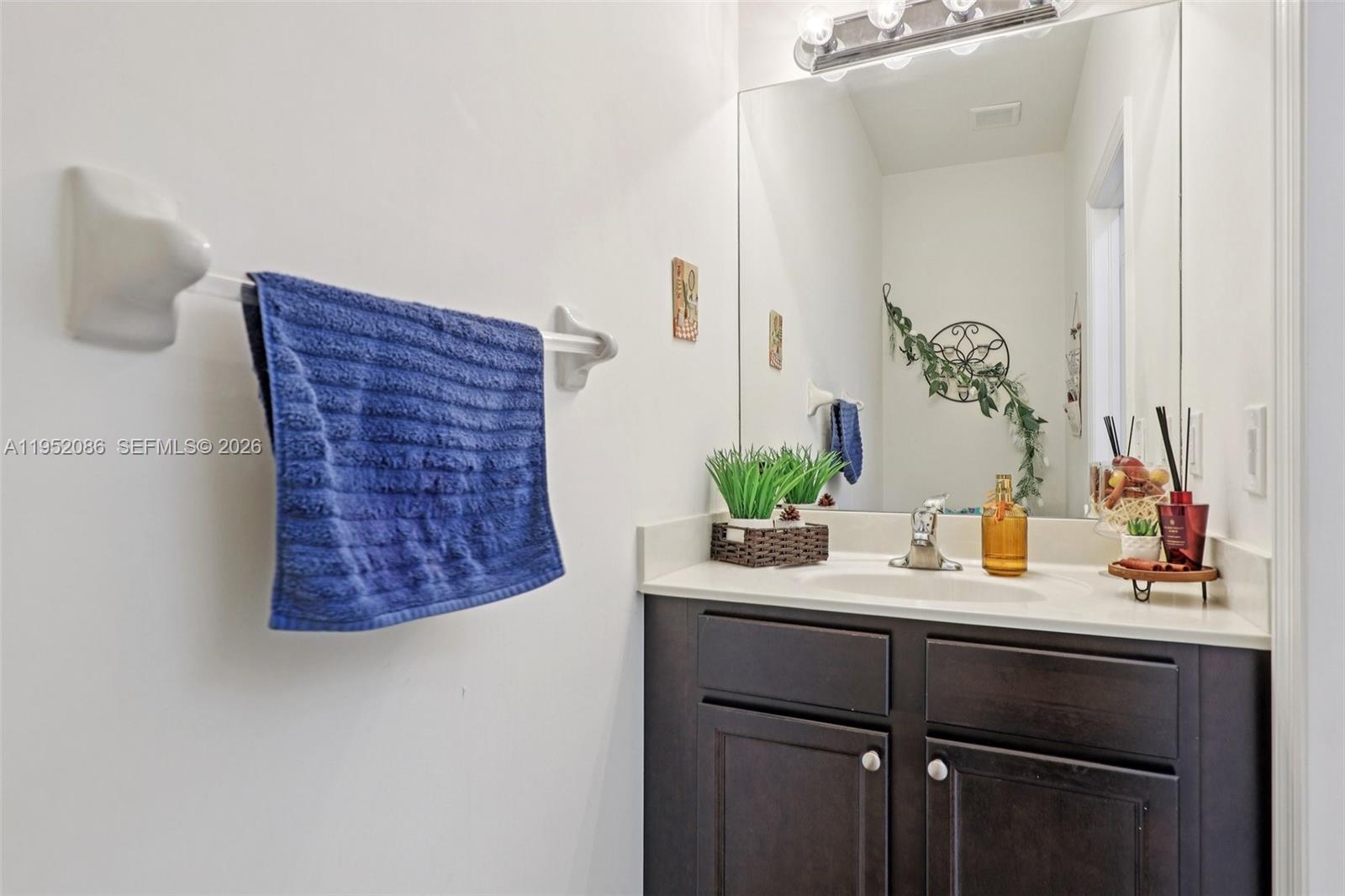 11746 Southwest 151 Avenue Miami, FL 33196 - Photo 15 of 37 a bathroom with a sink and a mirror