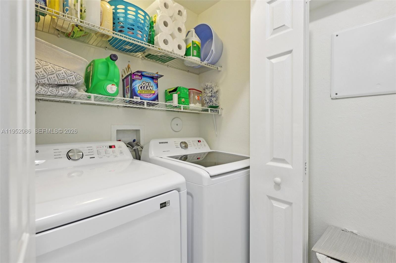 11746 Southwest 151 Avenue Miami, FL 33196 - Photo 16 of 37 a utility room with dryer and washer