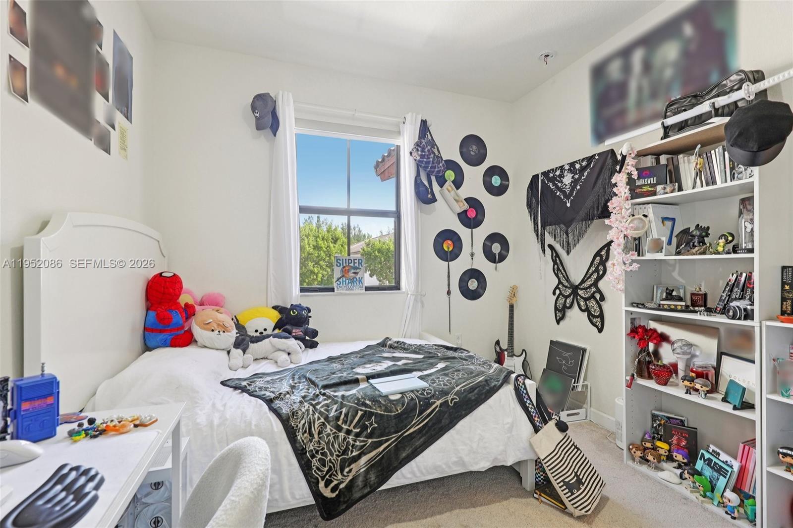 11746 Southwest 151 Avenue Miami, FL 33196 - Photo 19 of 37 a bed room with a bed and a window