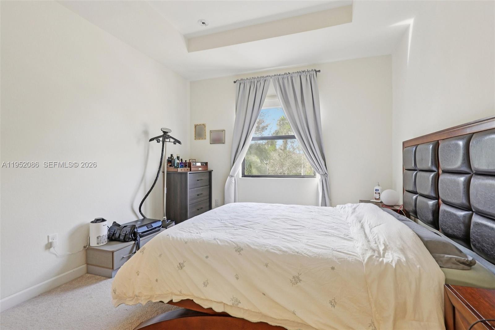 11746 Southwest 151 Avenue Miami, FL 33196 - Photo 29 of 37 a bedroom with a bed and a window