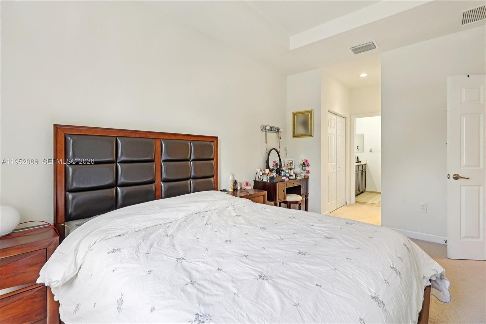 11746 Southwest 151 Avenue Miami, FL 33196 - Photo 30 of 37 a bedroom with a bed and a closet