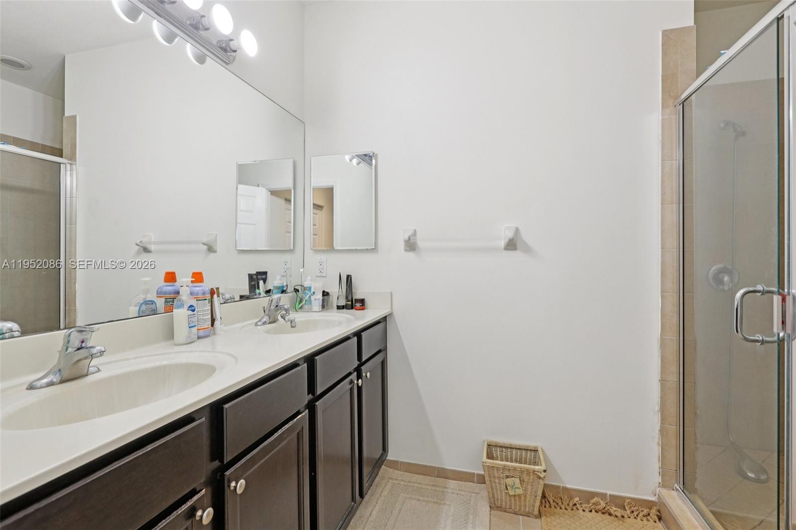 11746 Southwest 151 Avenue Miami, FL 33196 - Photo 31 of 37 a bathroom with a sink vanity granite and toilet