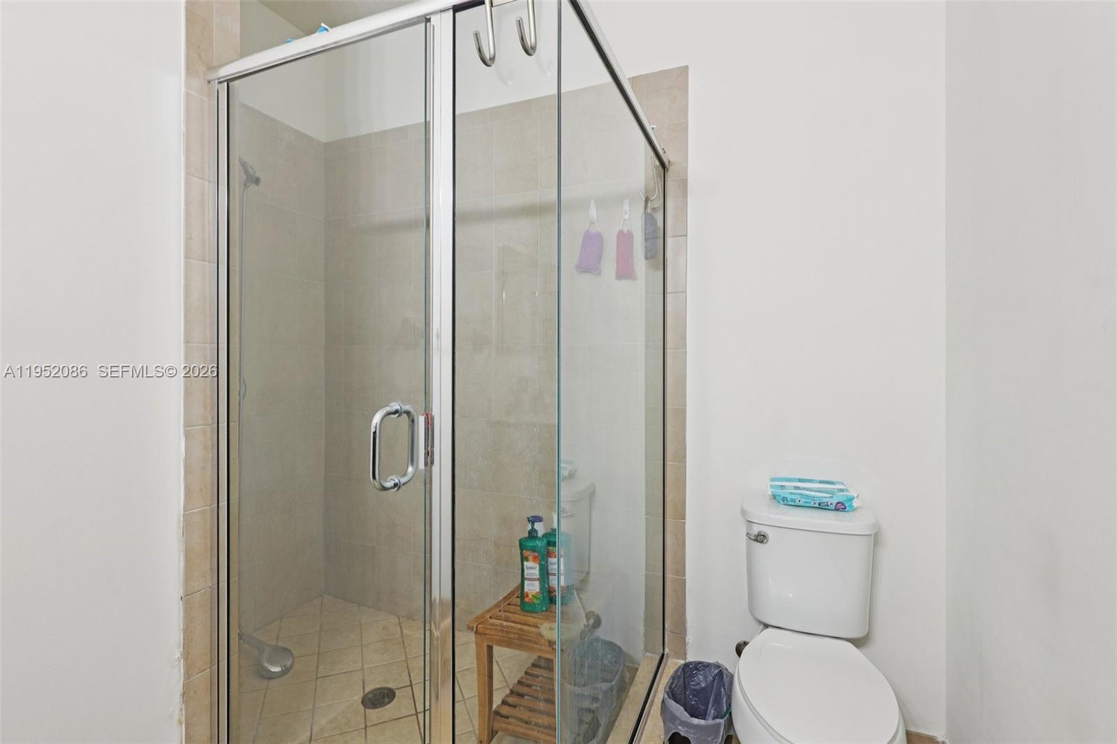 11746 Southwest 151 Avenue Miami, FL 33196 - Photo 32 of 37 a bathroom with a toilet and a shower