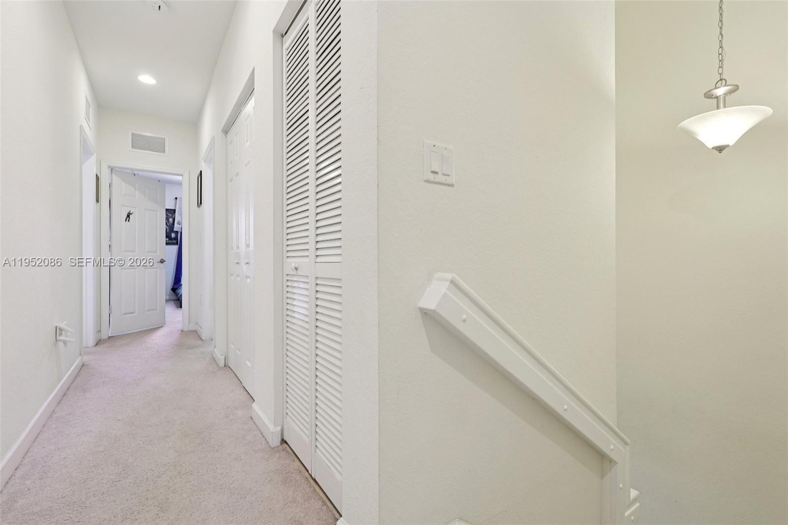 11746 Southwest 151 Avenue Miami, FL 33196 - Photo 33 of 37 a view of a hallway with wooden floor