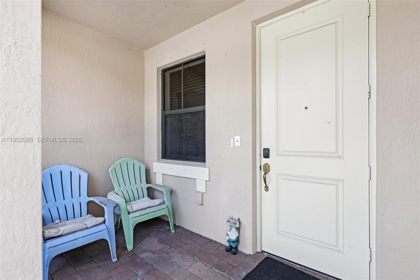 11746 Southwest 151 Avenue Miami, FL 33196 - Photo 34 of 37 a living room with furniture and a window