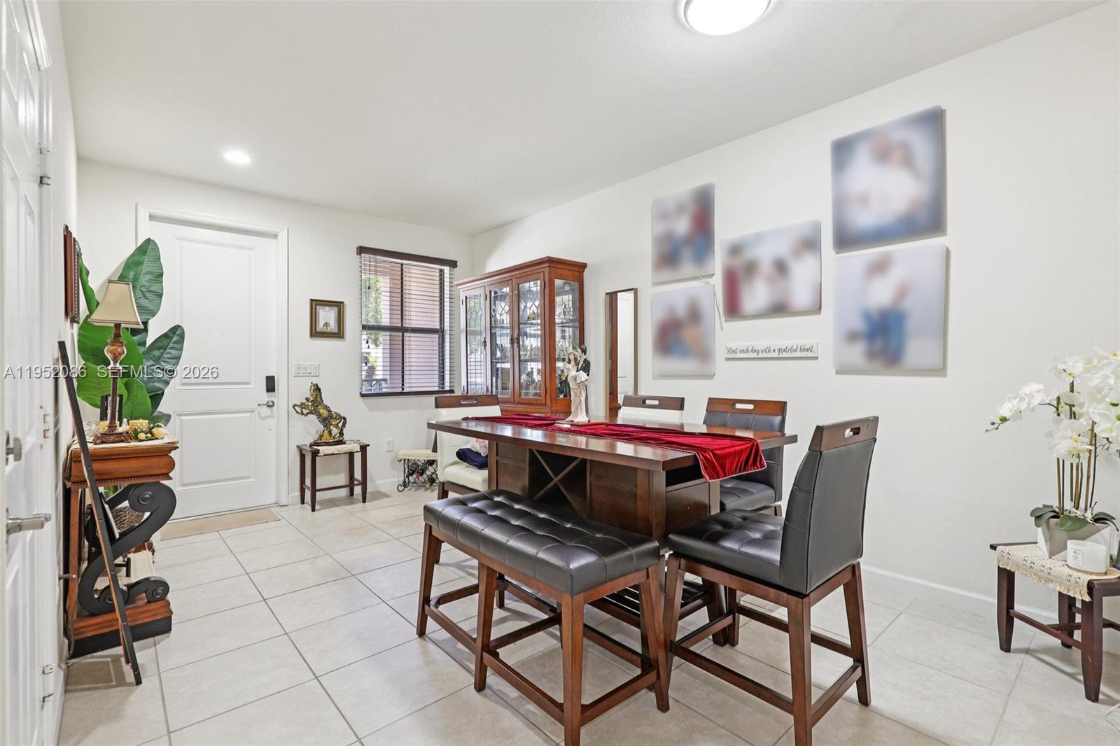 11746 Southwest 151 Avenue Miami, FL 33196 - Photo 9 of 37 a living room with furniture a rug and a potted plant