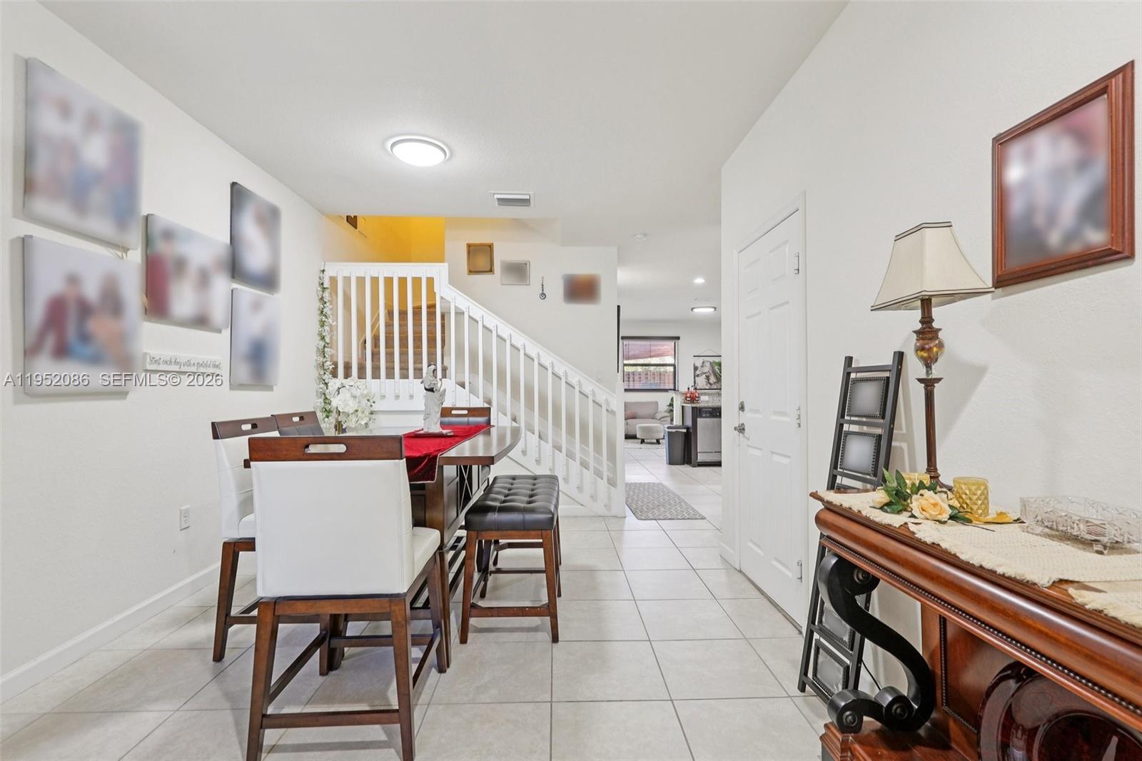 11746 Southwest 151 Avenue Miami, FL 33196 - Photo 10 of 37 a room with furniture and a flat screen tv