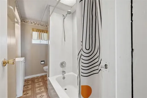 a bathroom with a sink a mirror and a shower
