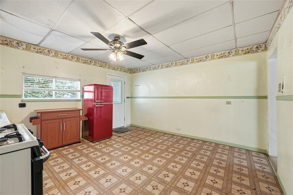 1616 Myler Street Pittsburgh, PA 15212 - Photo 5 of 25 a bedroom with a bed and a chandelier