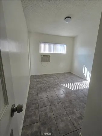 a view of an empty room and a window