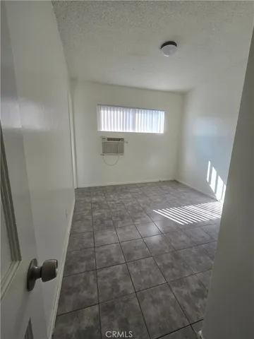 a view of an empty room and a window