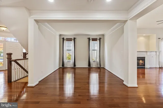 a spacious bathroom with a double vanity sink mirror and bathtub