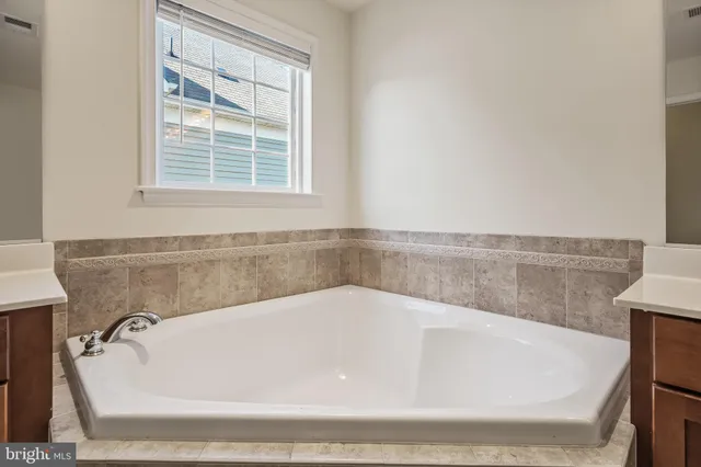a view of entryway with wooden floor and front door