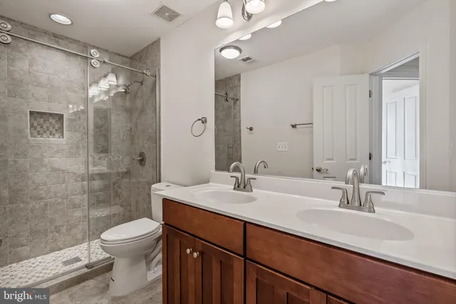 a view of entryway with wooden floor and stairs