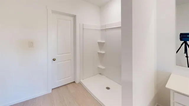 a bathroom with a sink and a shower