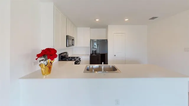 a room with a couch and chandelier