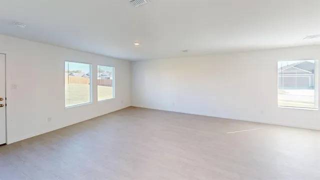 an empty room with windows