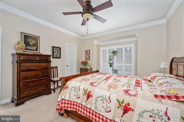 a view of a livingroom with a fireplace and a ceiling fan