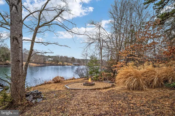 a view of an entryway with wooden floor and a livingroom
