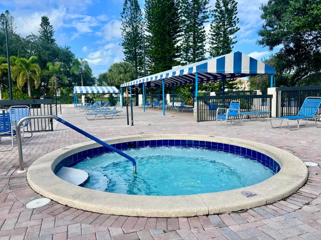 a view of a swimming pool with a patio