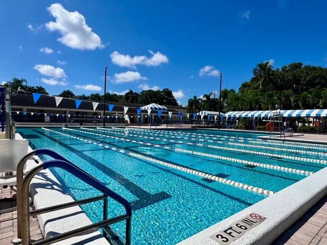 a view of a swimming pool with an outdoor space and seating area