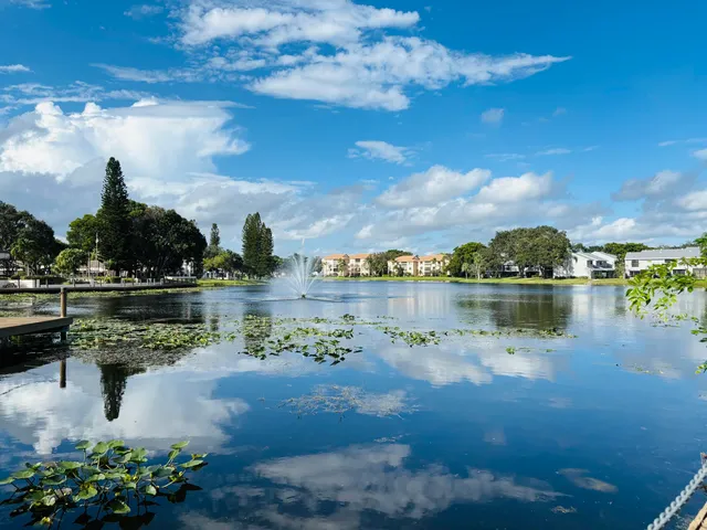 a view of a lake with houses in the back