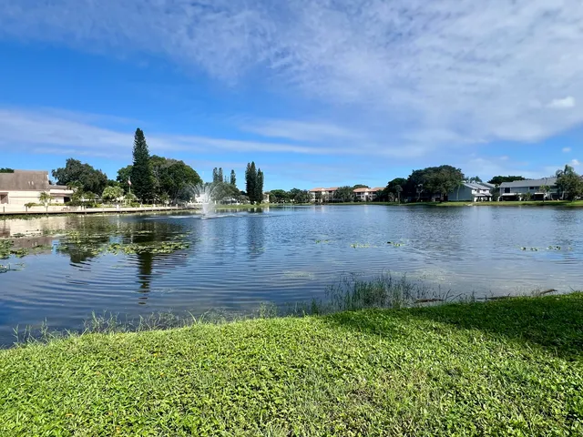a front view of a house with a yard table and chairs