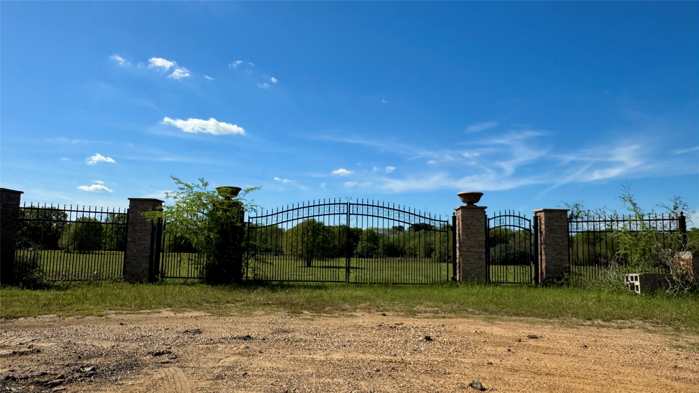 0 Meadow Creek Road Hockley, TX 77447 - Photo 2 of 18 Fully fenced acreage with a stone & iron welcome gate.