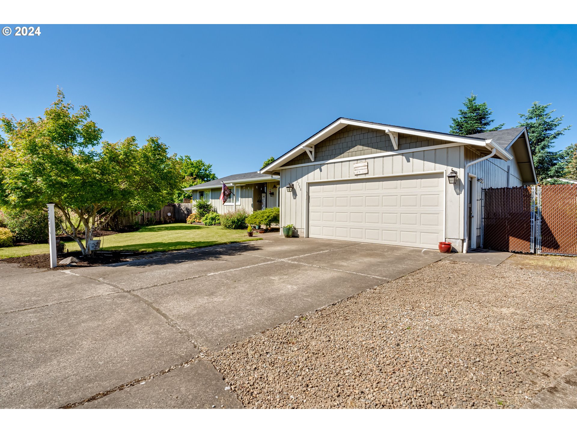 2288 9th Street Springfield, OR 97477 - Photo 1 of 41 a front view of a house with a yard and garage