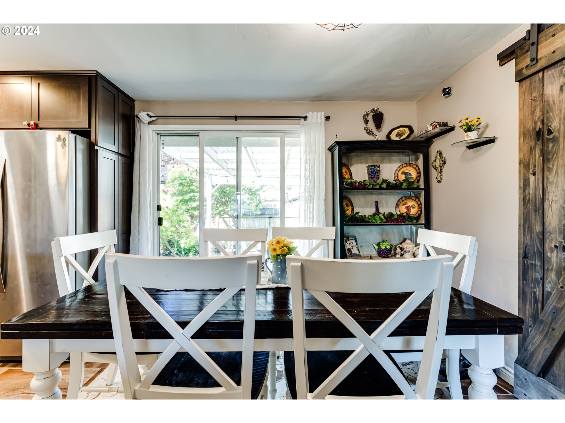 2288 9th Street Springfield, OR 97477 - Photo 16 of 41 a view of a dining room with furniture and a window