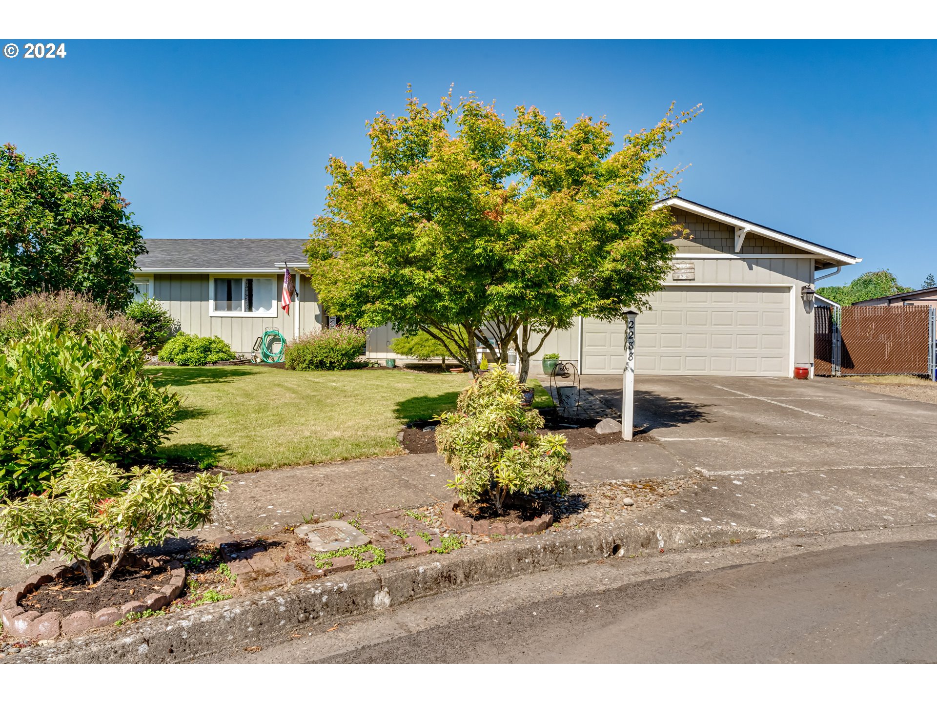 2288 9th Street Springfield, OR 97477 - Photo 2 of 41 a backyard of a house with table and chairs