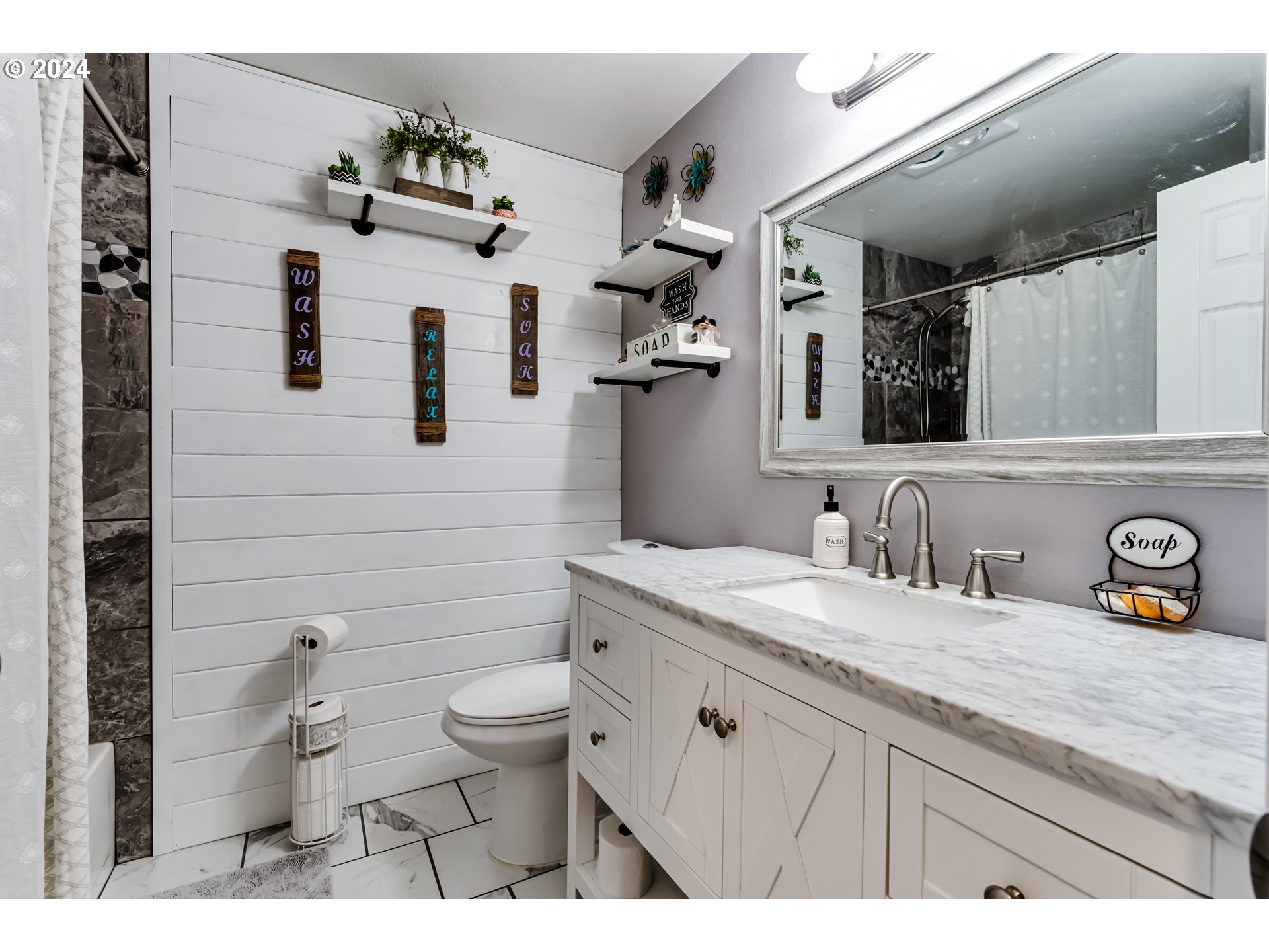 2288 9th Street Springfield, OR 97477 - Photo 23 of 41 a bathroom with a granite countertop sink vanity mirror and toilet