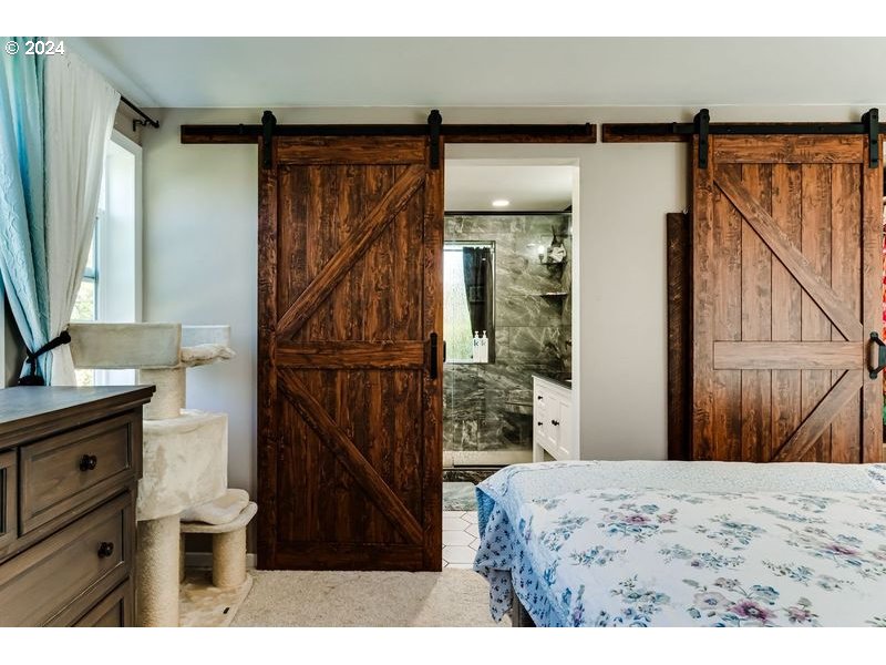 2288 9th Street Springfield, OR 97477 - Photo 31 of 41 a bed room with a bed and a mirror