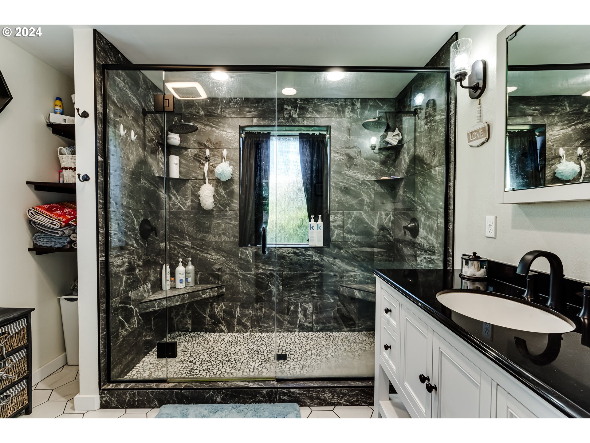 2288 9th Street Springfield, OR 97477 - Photo 32 of 41 a bathroom with a granite countertop sink a mirror and shower