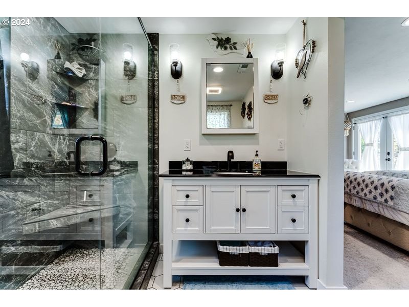 2288 9th Street Springfield, OR 97477 - Photo 33 of 41 a bathroom with a sink double vanity and a mirror