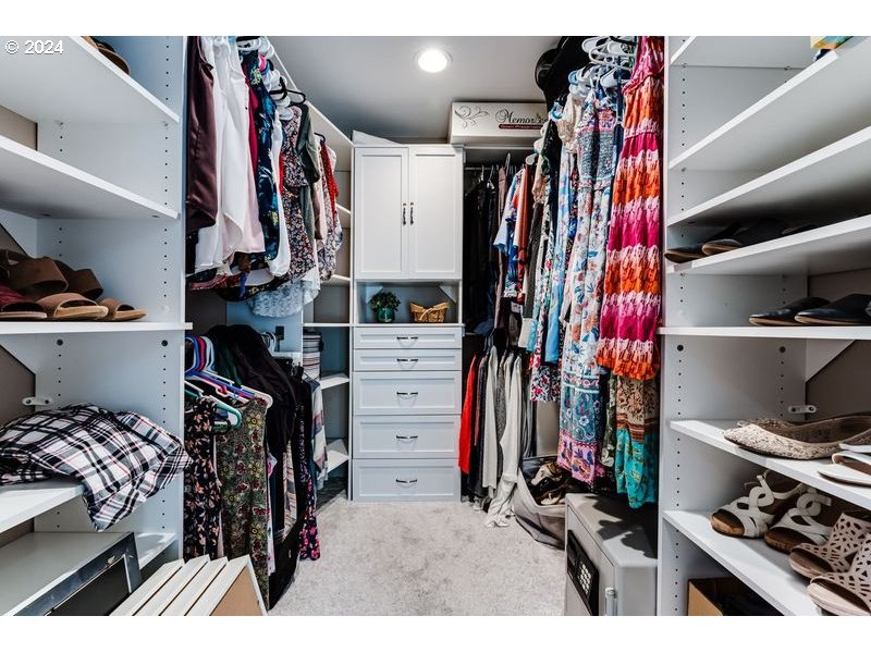 2288 9th Street Springfield, OR 97477 - Photo 34 of 41 a view of walk in closet with clothes and shoes