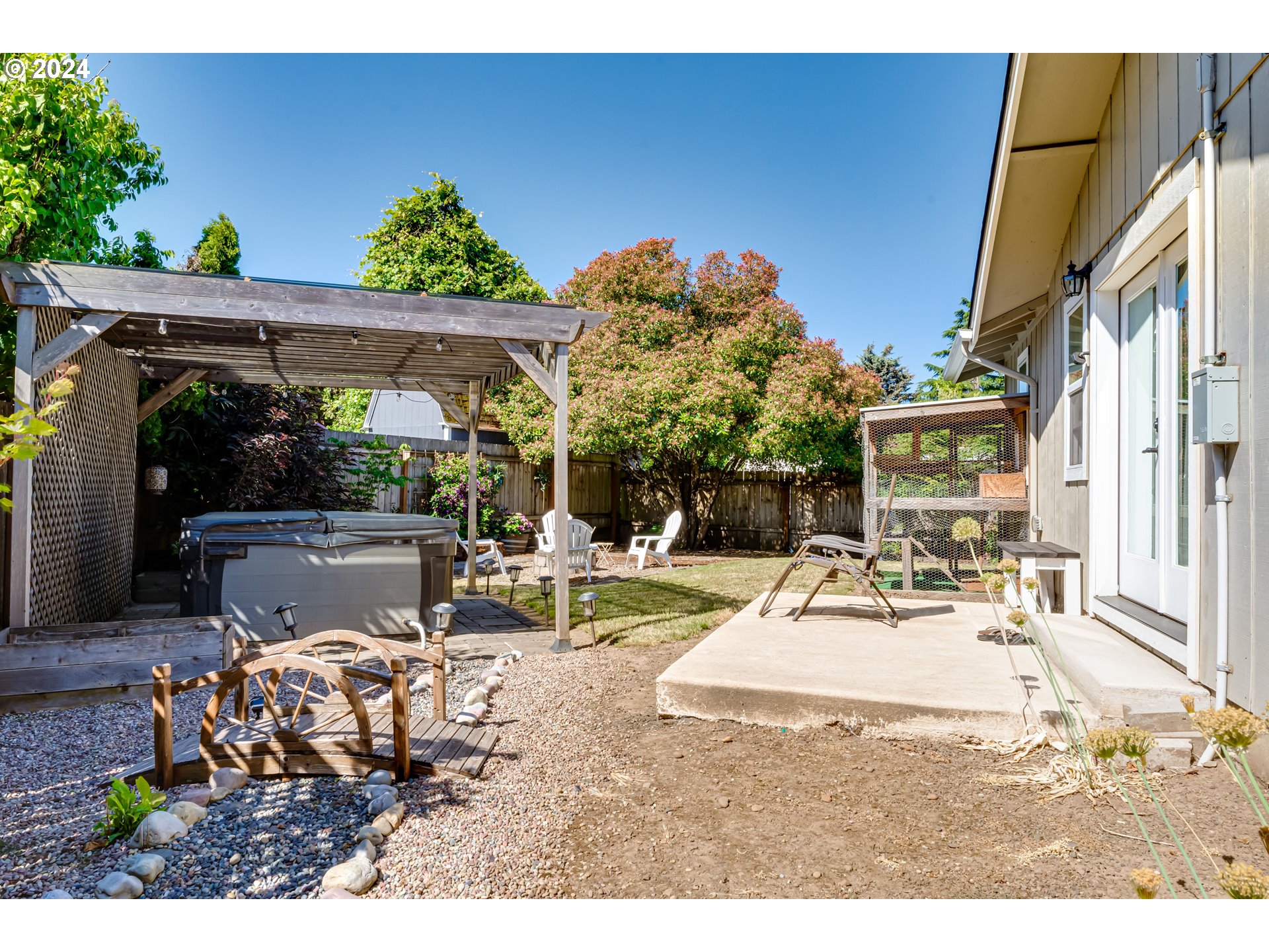 2288 9th Street Springfield, OR 97477 - Photo 40 of 41 a view of a patio with table and chairs and potted plants
