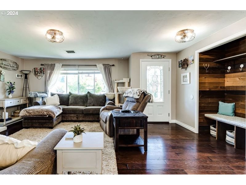 2288 9th Street Springfield, OR 97477 - Photo 5 of 41 a living room with furniture and a wooden floor