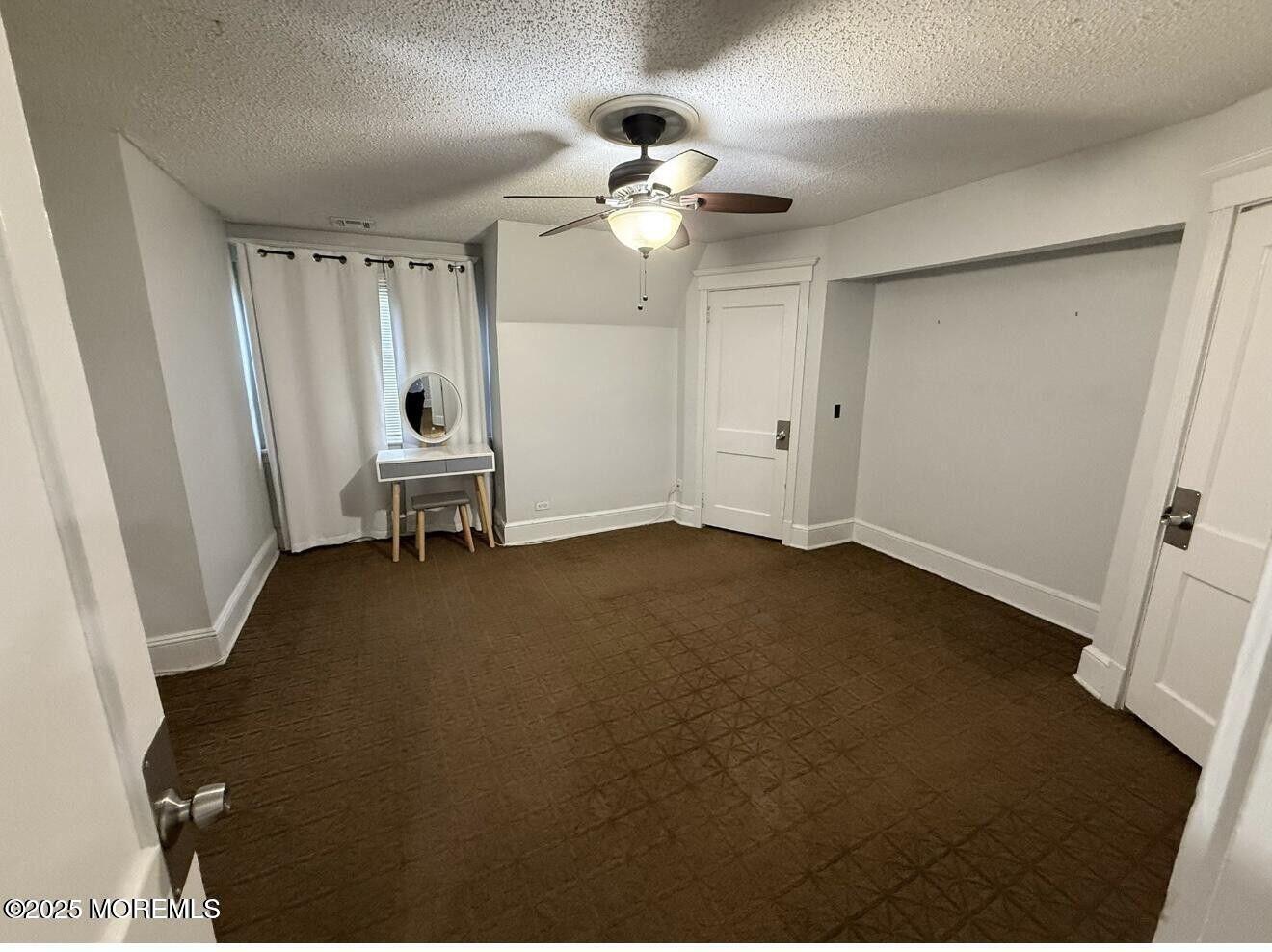 1001 Norwood Avenue, Unit 4 Long Branch, NJ 07740 - Photo 6 of 9 a view of an empty room with a window