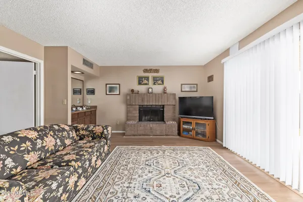a living room with furniture and a fireplace