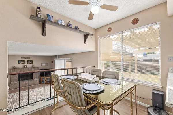 a view of a dining room with furniture window and outside view