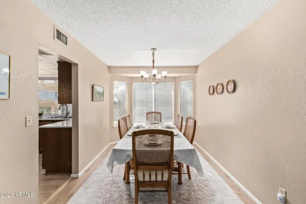 a view of a hallway with furniture and front door
