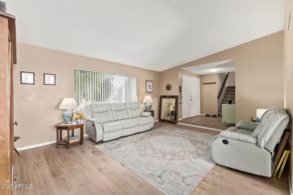 a living room with furniture and a couch