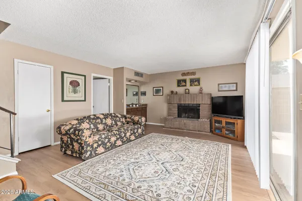 a bedroom with furniture and a flat screen tv