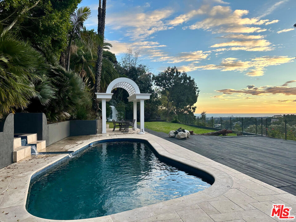 a view of a swimming pool with a sitting space